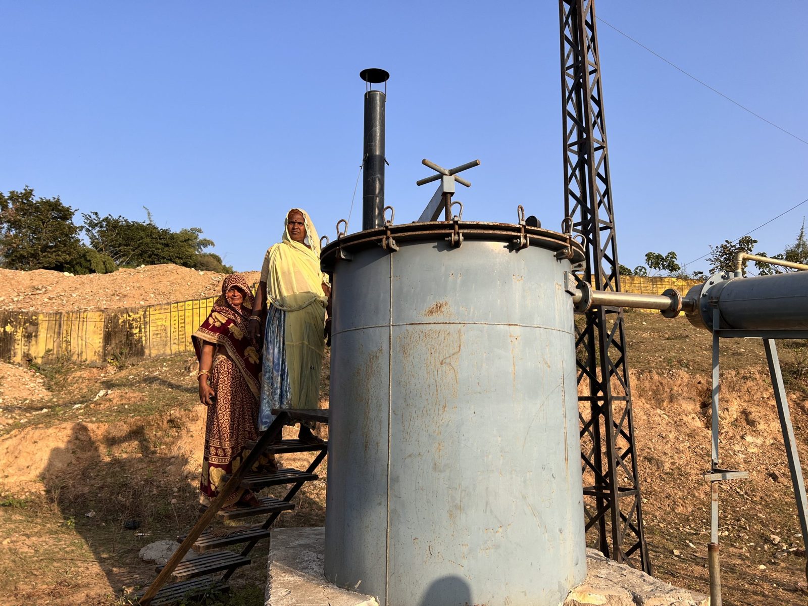 The cluster's steam-distillation unit under a blue sky