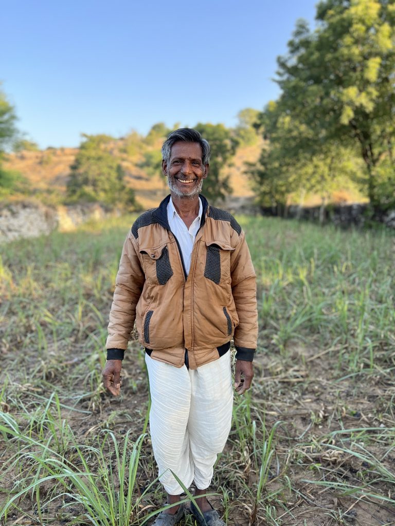 Moti Lal ji standing on his lemongrass farm